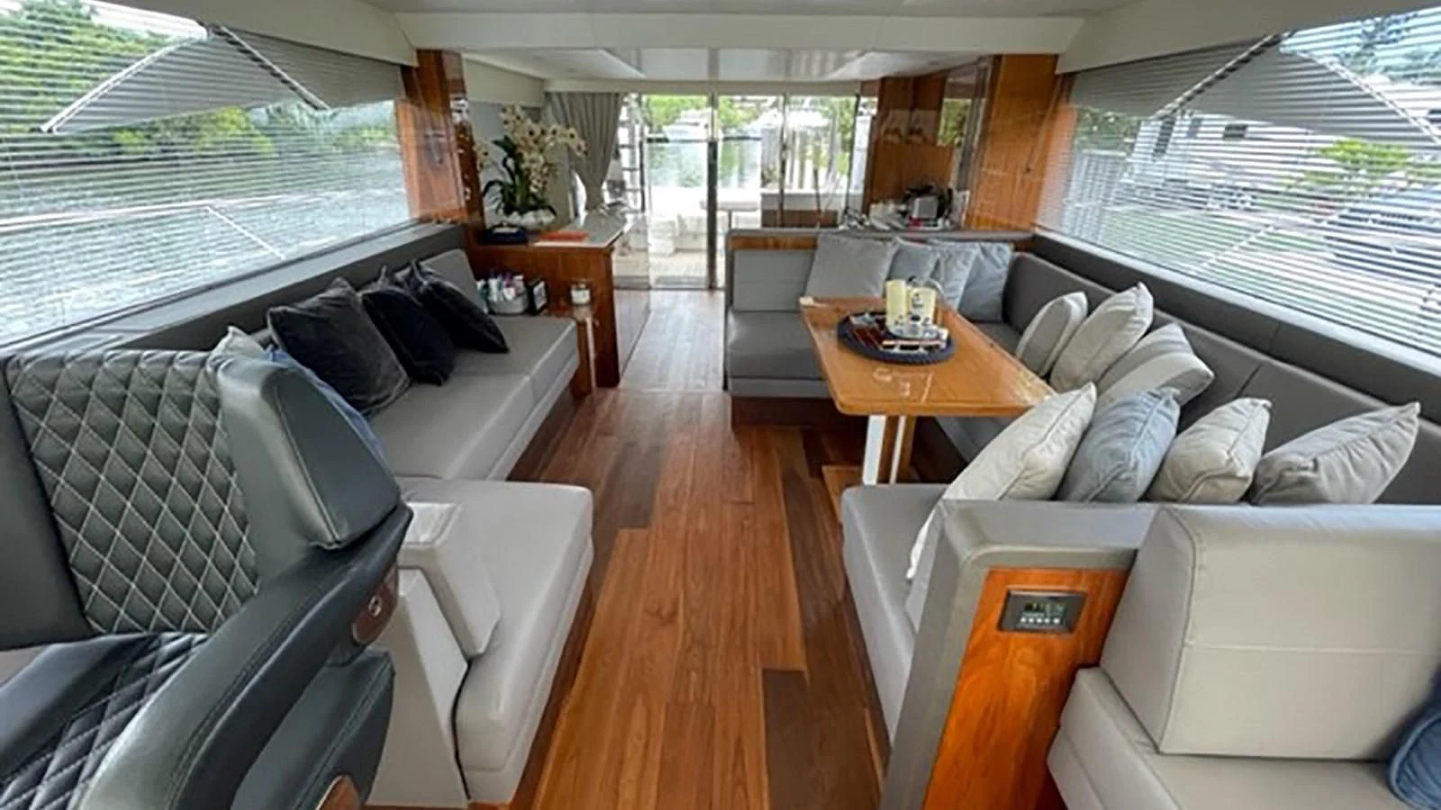 a living room with a couch and a table aboard EXIT Yacht for Sale