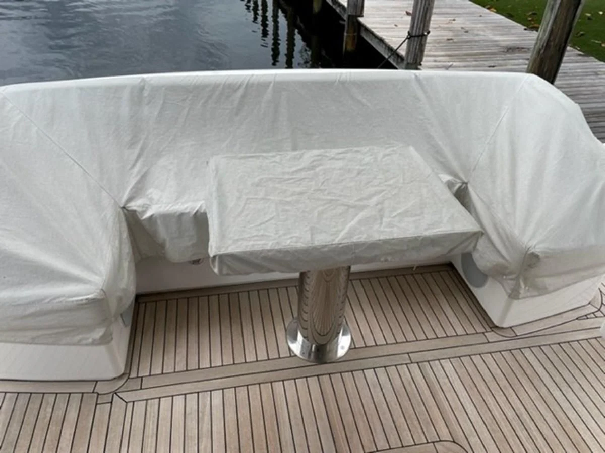 a white bed on a deck aboard EXIT Yacht for Sale