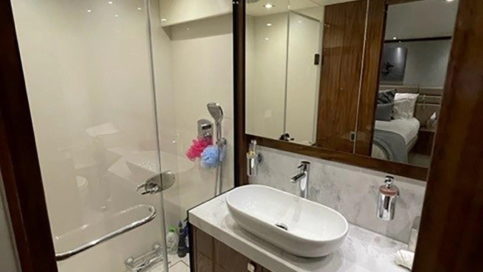 a bathroom with a sink and a mirror aboard EXIT Yacht for Sale