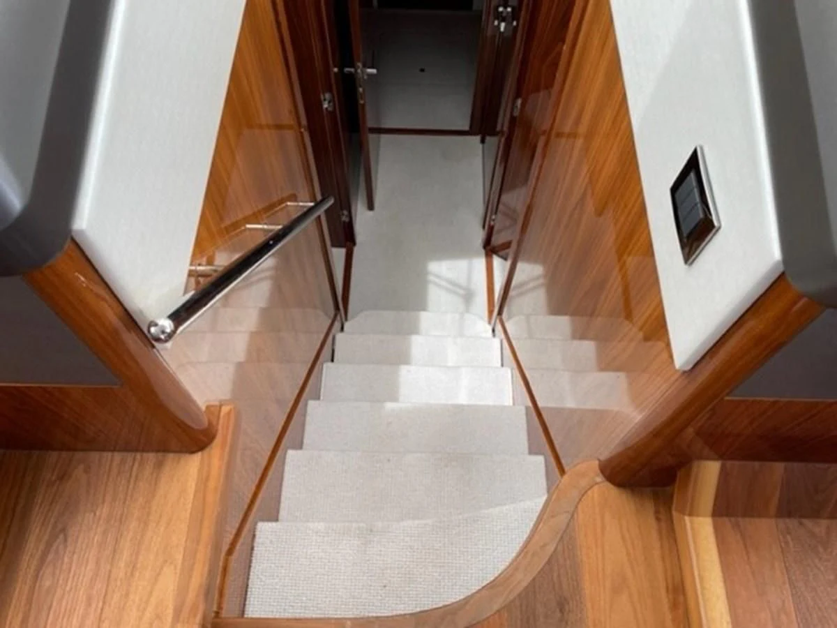 a hallway with a wood door aboard EXIT Yacht for Sale