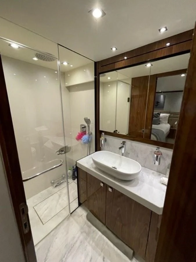 a bathroom with a glass shower aboard EXIT Yacht for Sale
