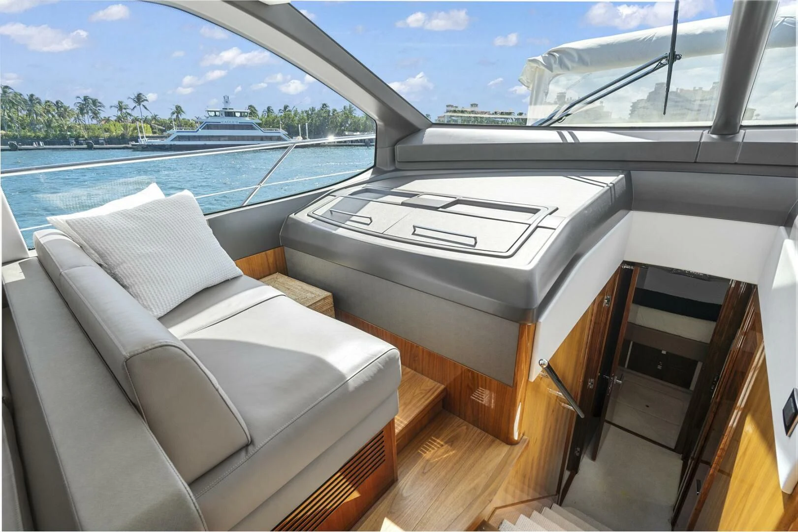 a room with a bed and a large window aboard EXIT Yacht for Sale