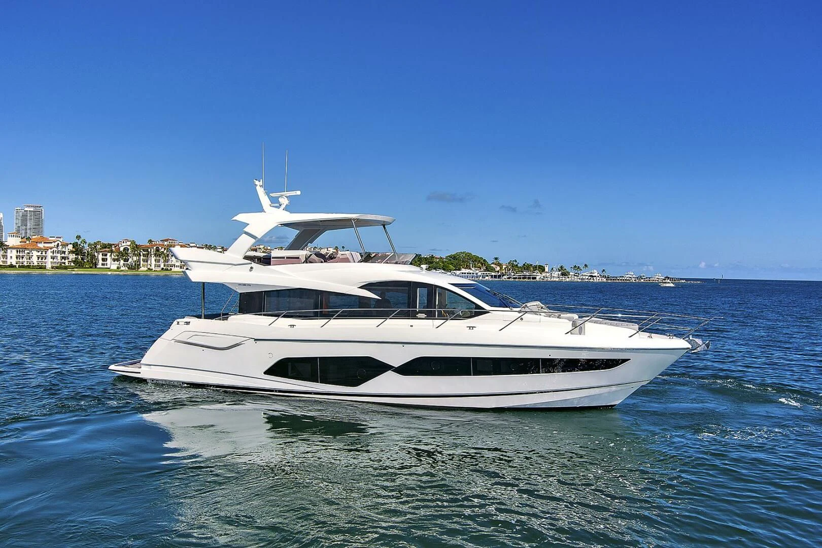 a white yacht in the water aboard EXIT Yacht for Sale