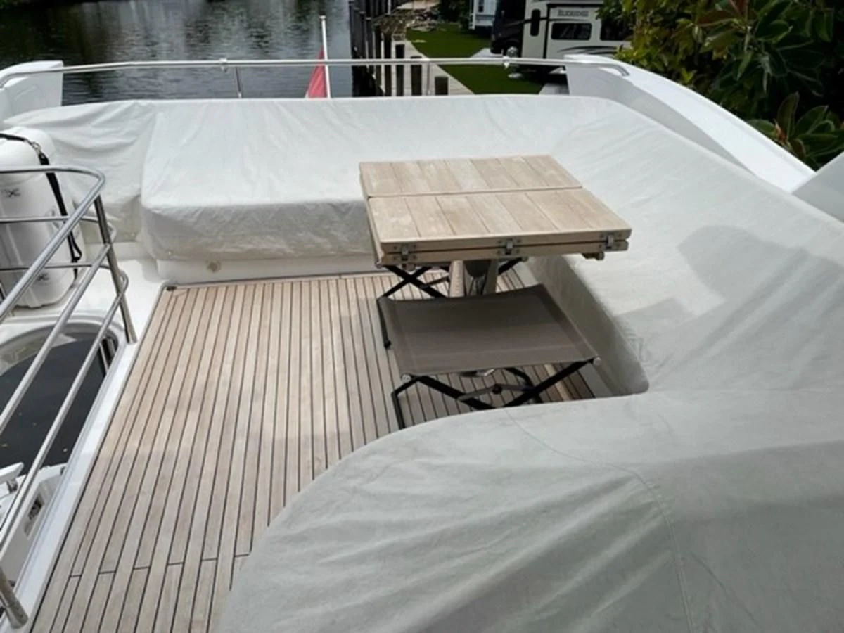 a table on a deck aboard EXIT Yacht for Sale