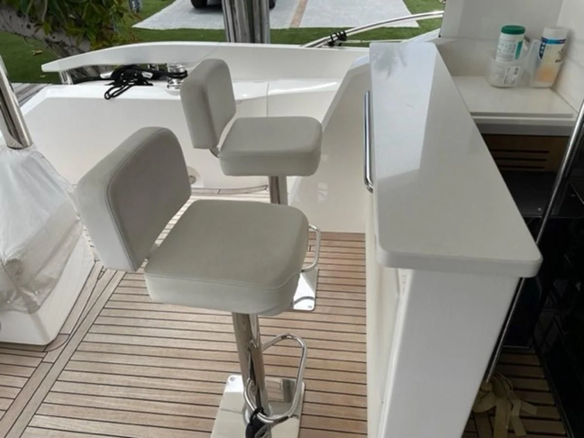 a white chair in a room aboard EXIT Yacht for Sale