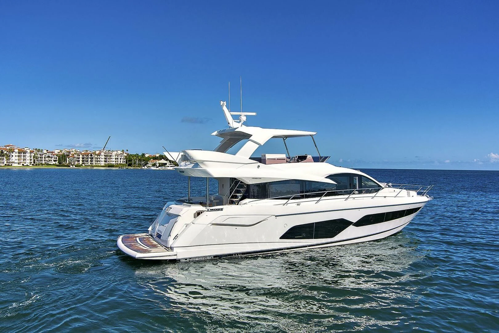 a white boat in the water aboard EXIT Yacht for Sale