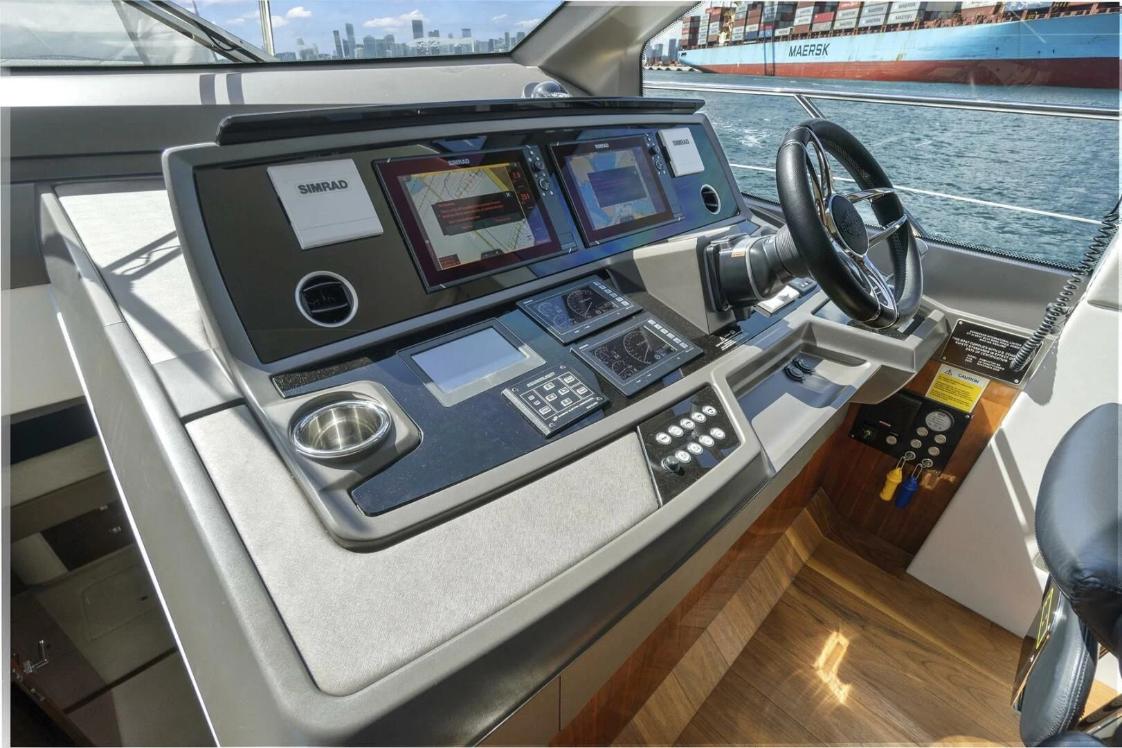 a car with a screen and a steering wheel aboard EXIT Yacht for Sale