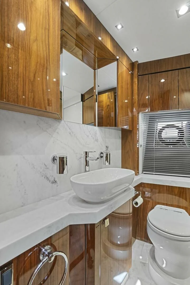 a bathroom with a sink and toilet aboard EXIT Yacht for Sale
