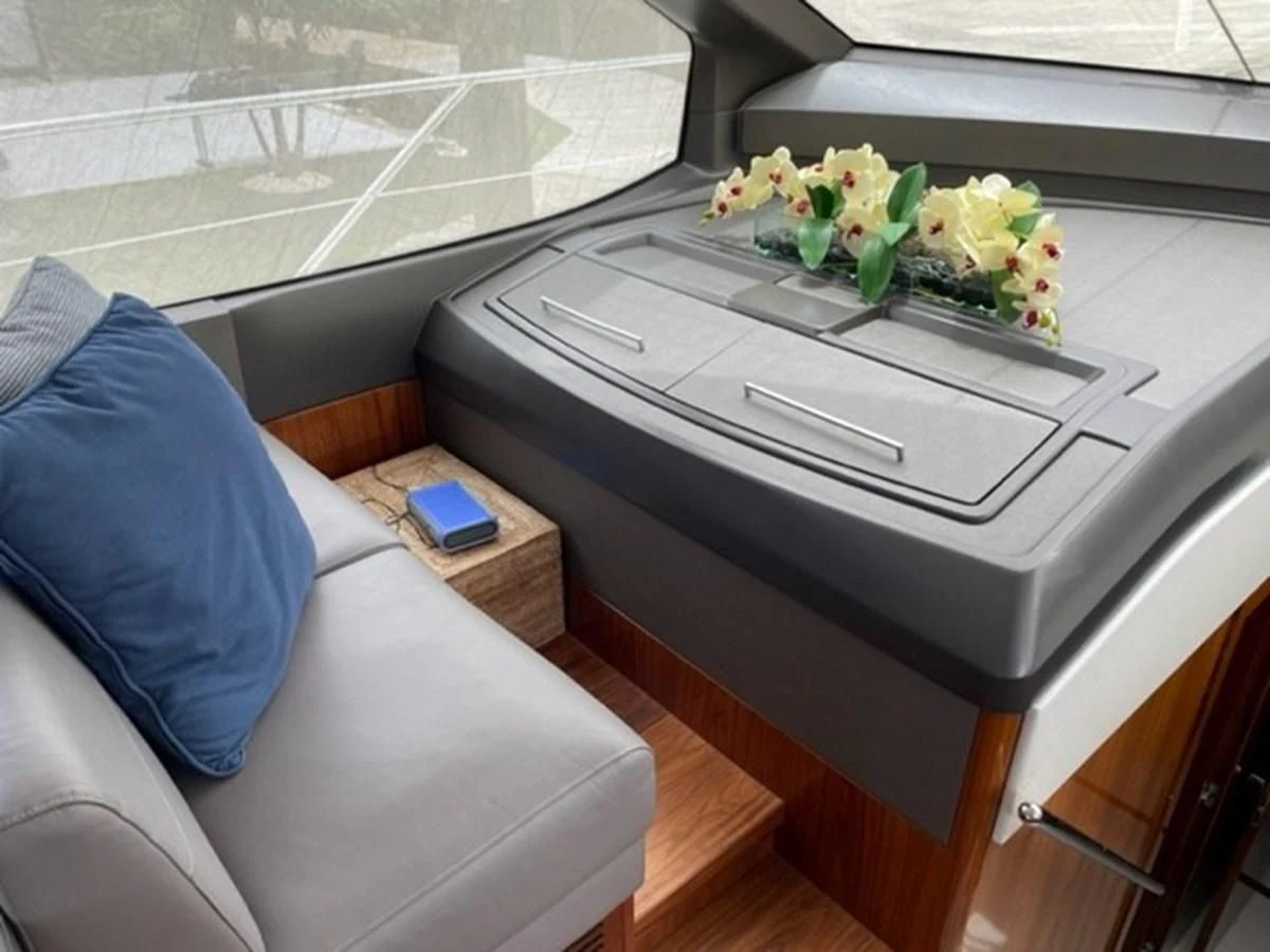 a table with a flower arrangement aboard EXIT Yacht for Sale