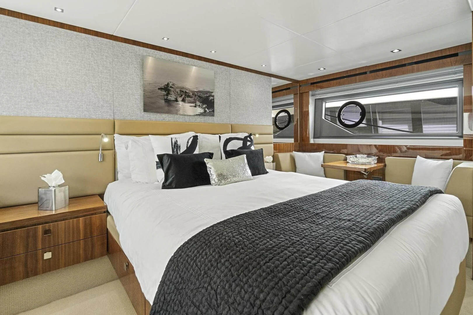 a bed with white sheets and pillows aboard EXIT Yacht for Sale