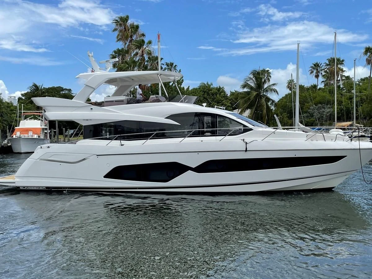 a white yacht in the water aboard EXIT Yacht for Sale