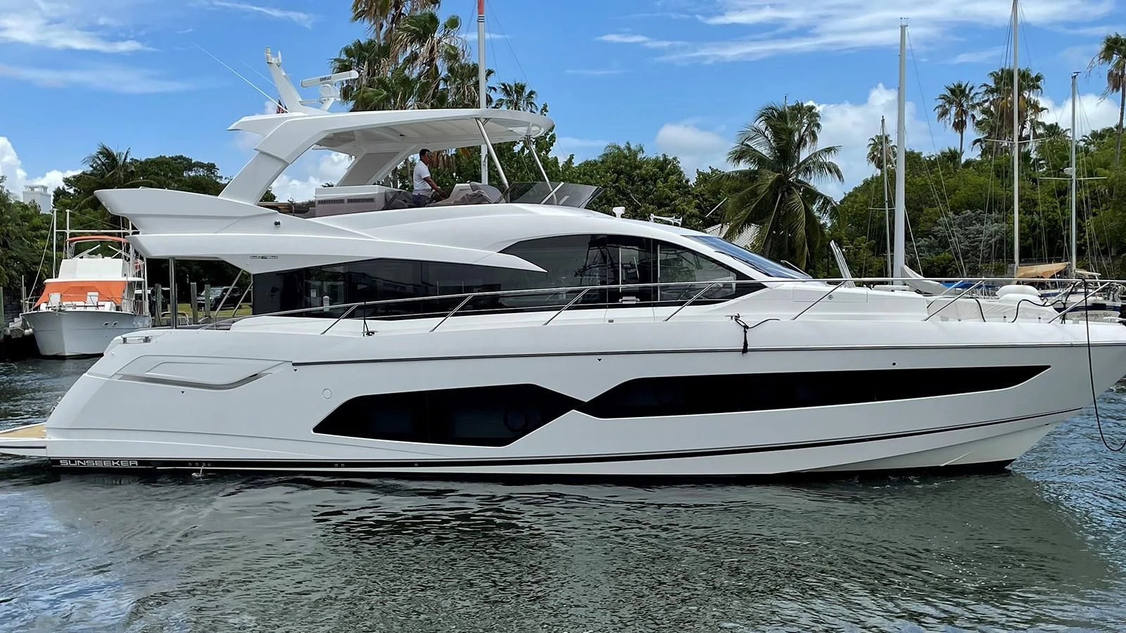 a white yacht in the water aboard EXIT Yacht for Sale