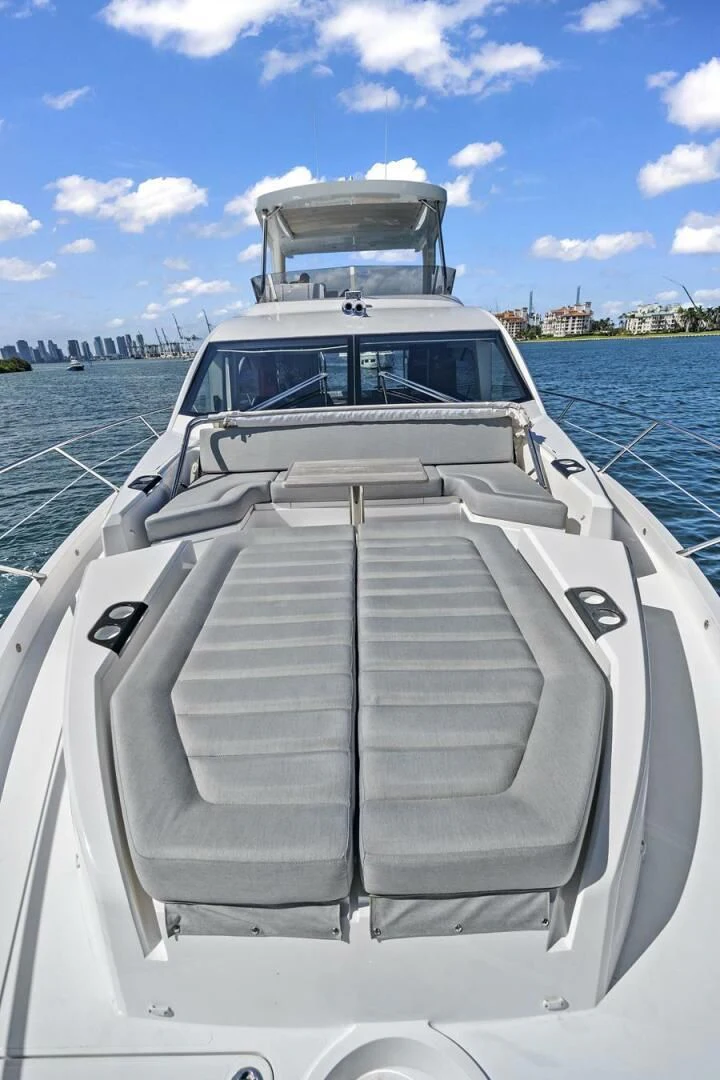 a boat with a large white ship on it aboard EXIT Yacht for Sale