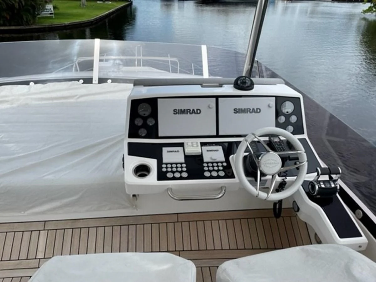 a white car with a screen aboard EXIT Yacht for Sale