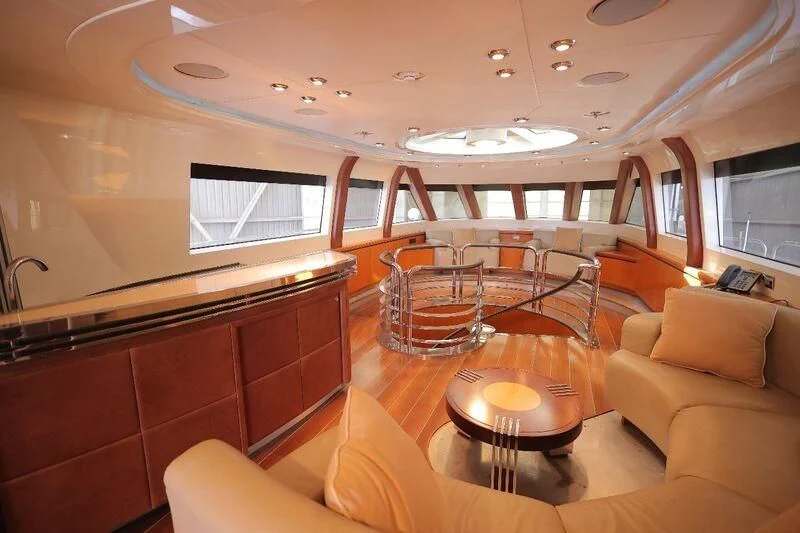 inside of a building with a table and chairs aboard OCEAN 1 Yacht for Sale