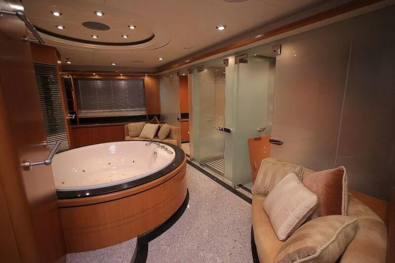 a large bathroom with a large tub aboard OCEAN 1 Yacht for Sale