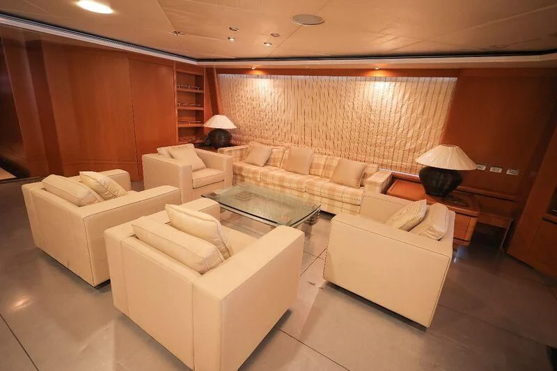 a living room with a couch and a table aboard OCEAN 1 Yacht for Sale
