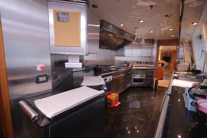a kitchen with a large island aboard OCEAN 1 Yacht for Sale