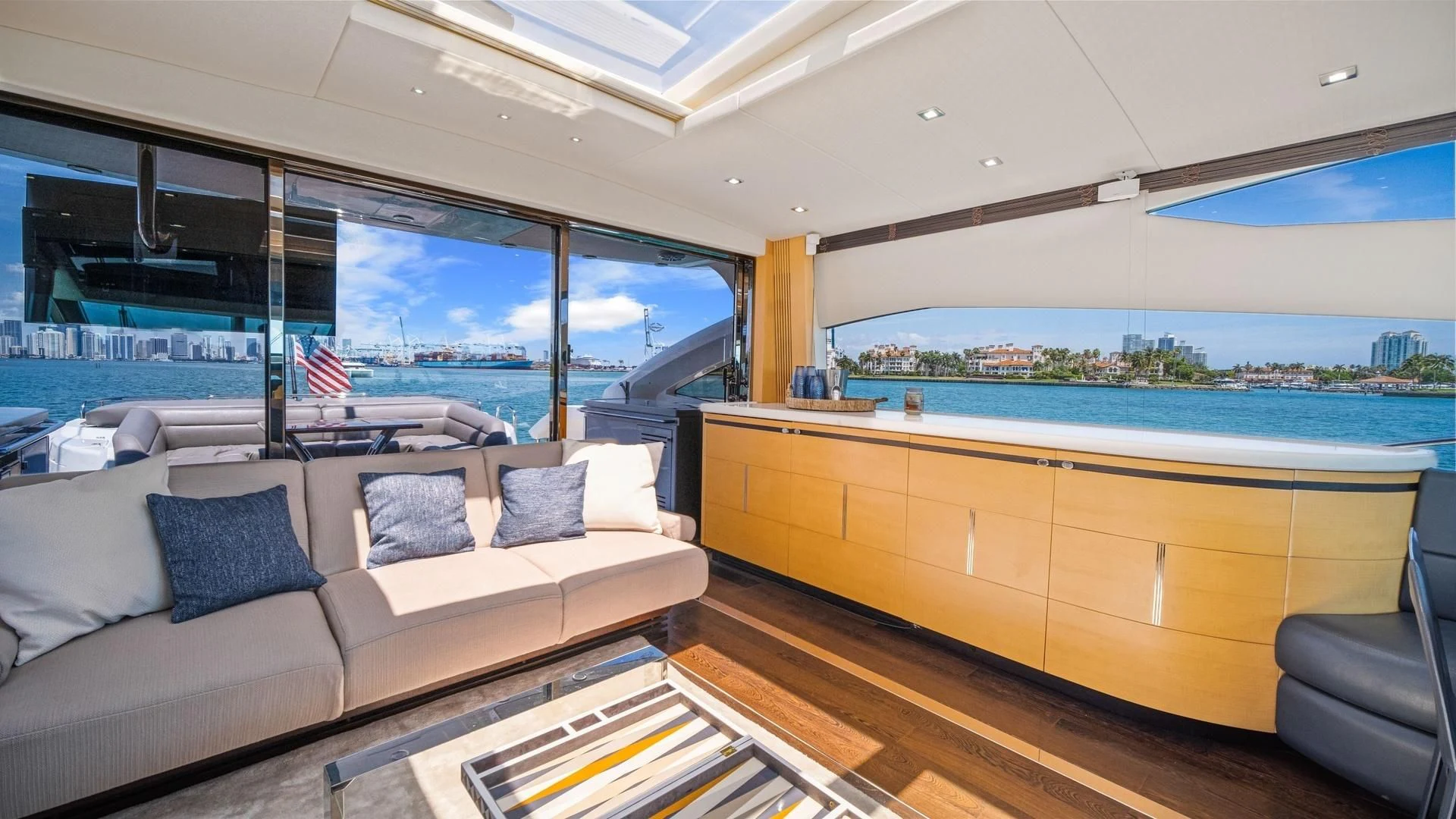 a living room with a large window aboard WOODEVER Yacht for Sale