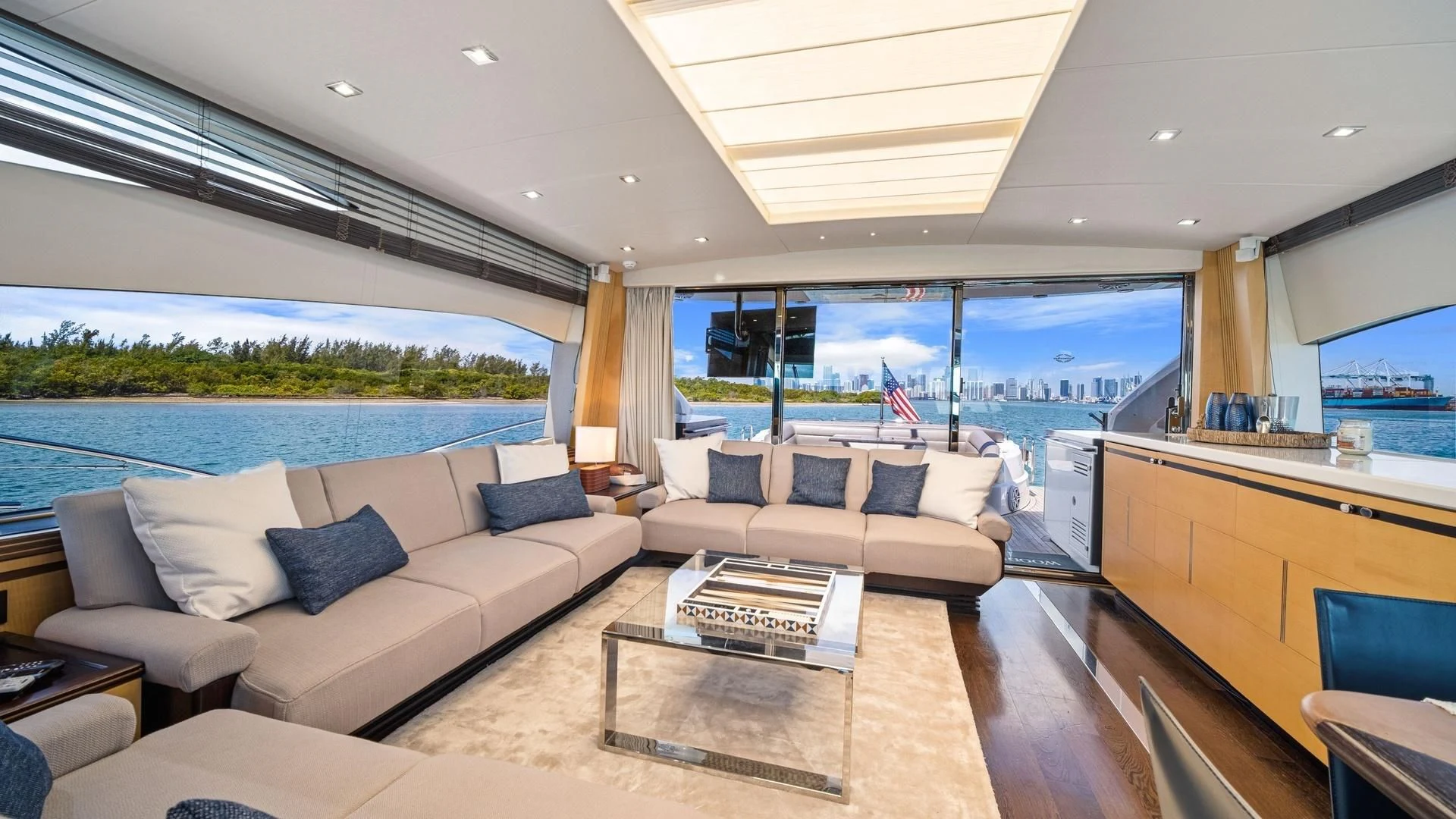 a living room with a large window aboard WOODEVER Yacht for Sale