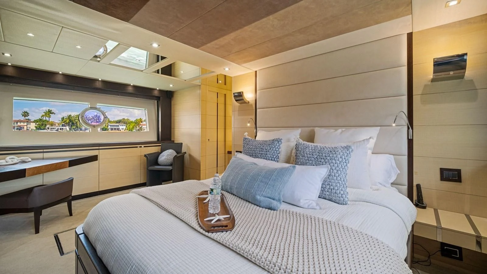 a bed with a white sheet and pillows aboard WOODEVER Yacht for Sale