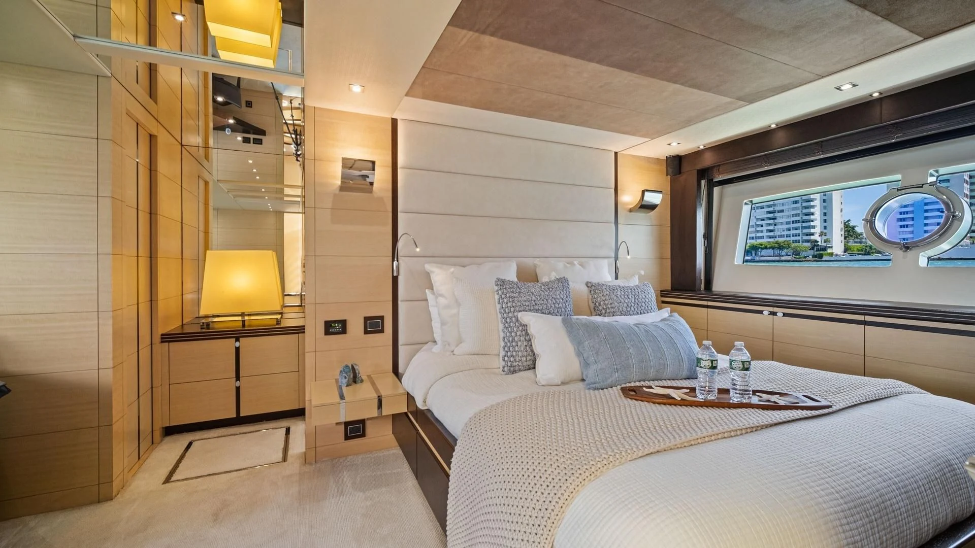 a room with a bed and a shelf with a window aboard WOODEVER Yacht for Sale