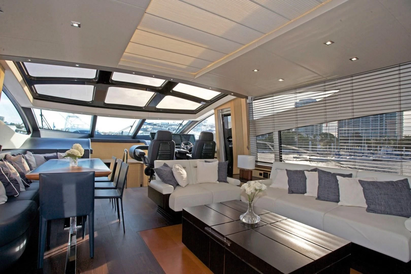 a room with a table and chairs aboard WOODEVER Yacht for Sale
