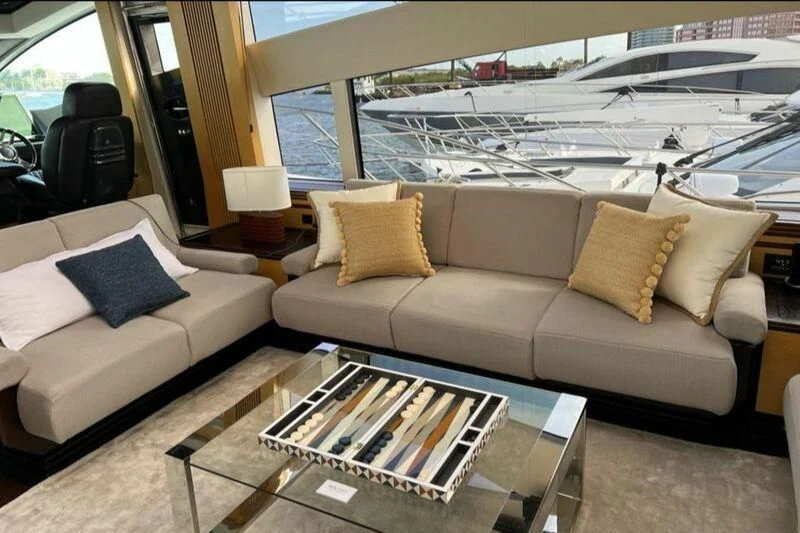 a living room with a couch and a table aboard WOODEVER Yacht for Sale