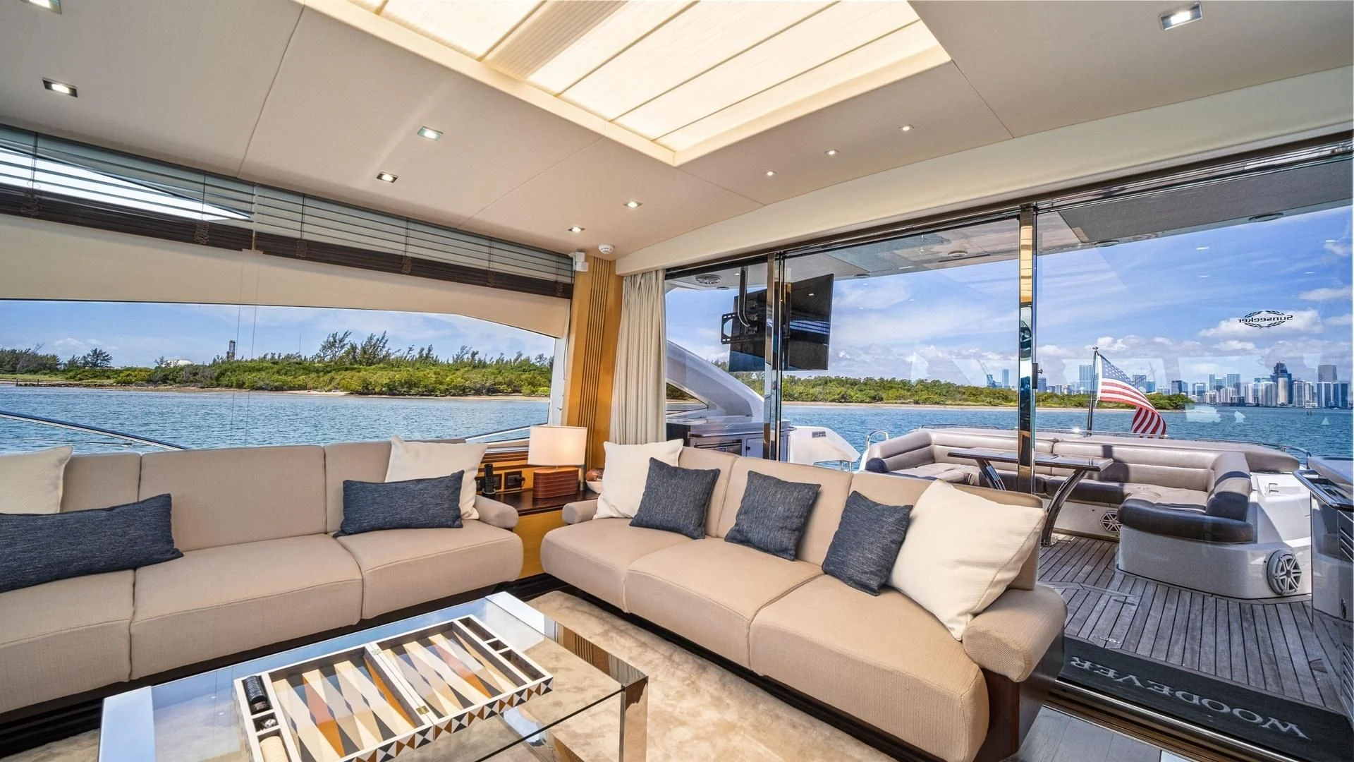 a living room with a large window aboard WOODEVER Yacht for Sale