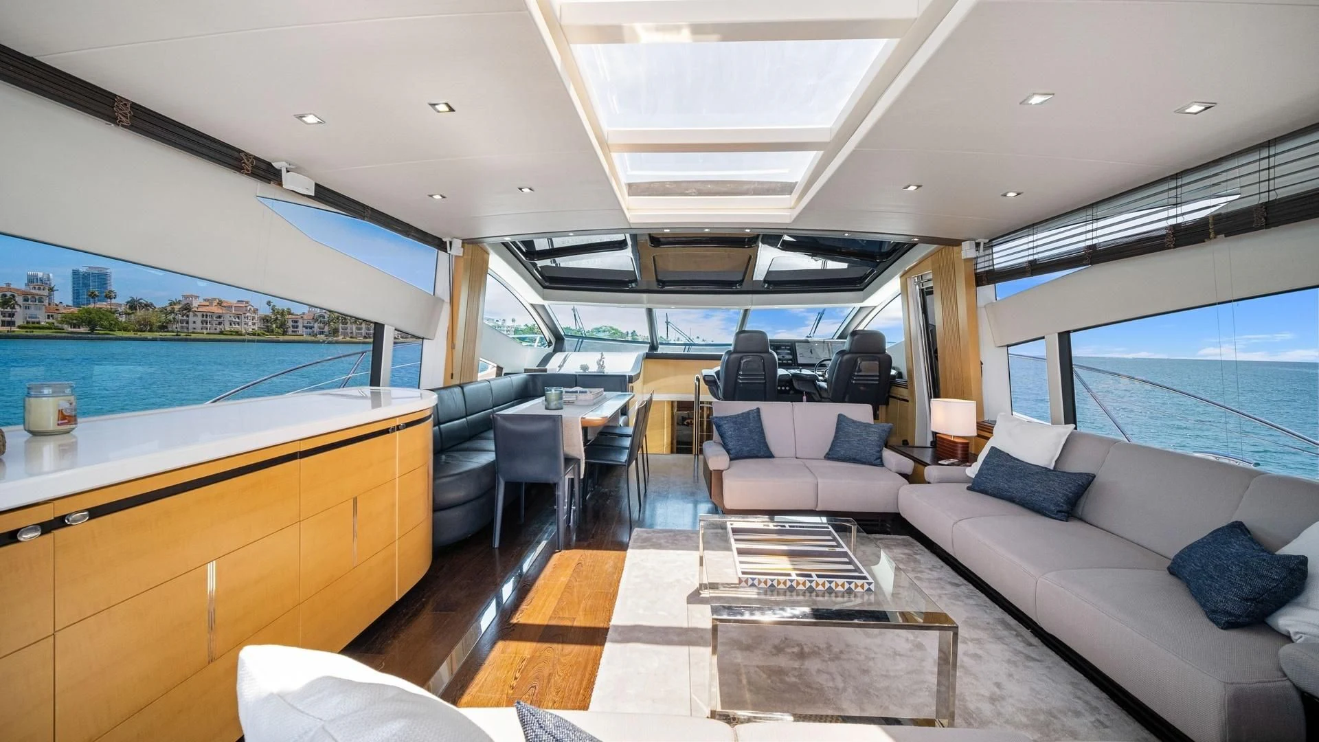 a large living room with a large window aboard WOODEVER Yacht for Sale