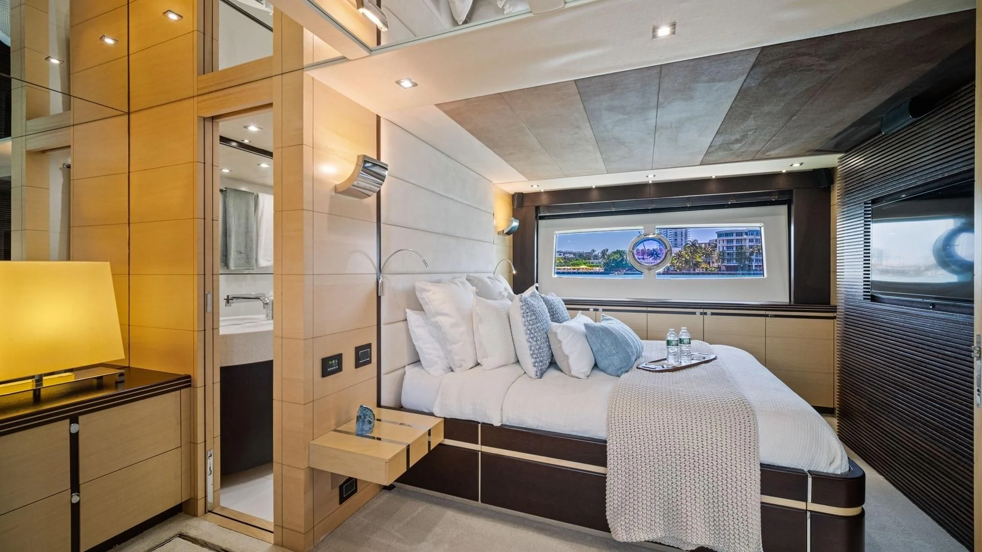 a bedroom with a bed and a television aboard WOODEVER Yacht for Sale