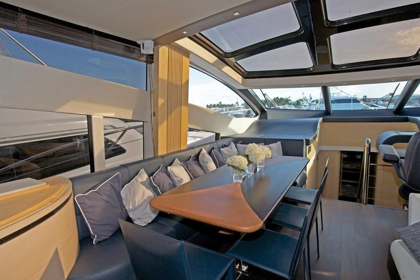 a room with a table and chairs aboard WOODEVER Yacht for Sale