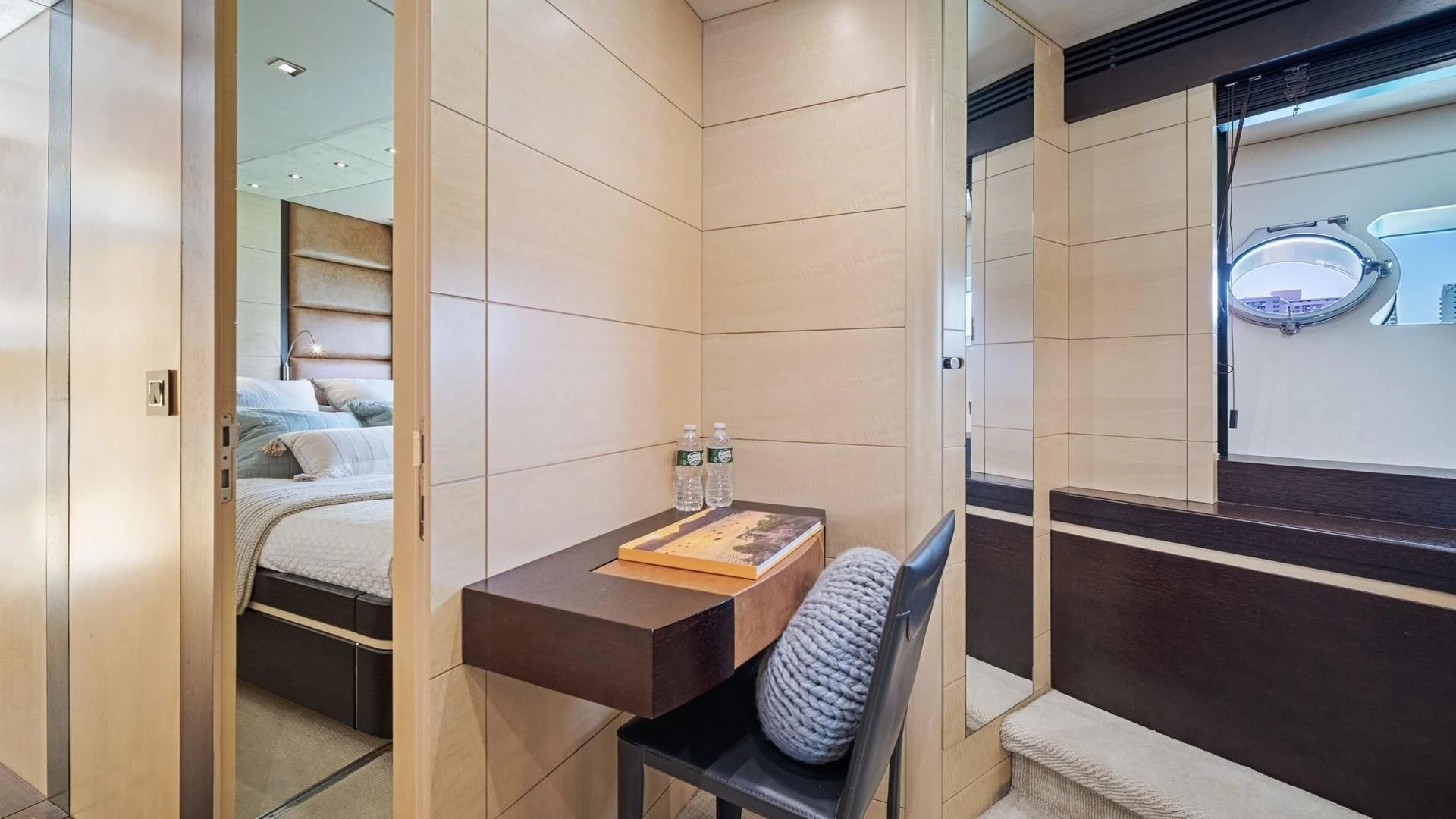 a room with a bed and a table aboard WOODEVER Yacht for Sale