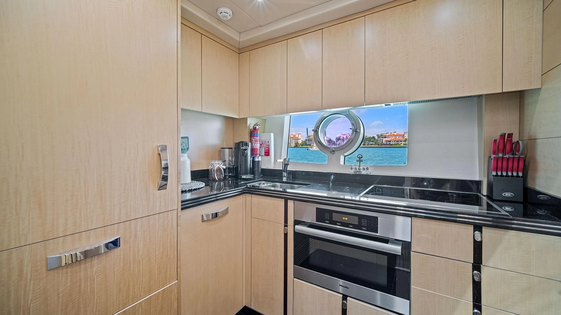 a kitchen with wooden cabinets aboard WOODEVER Yacht for Sale