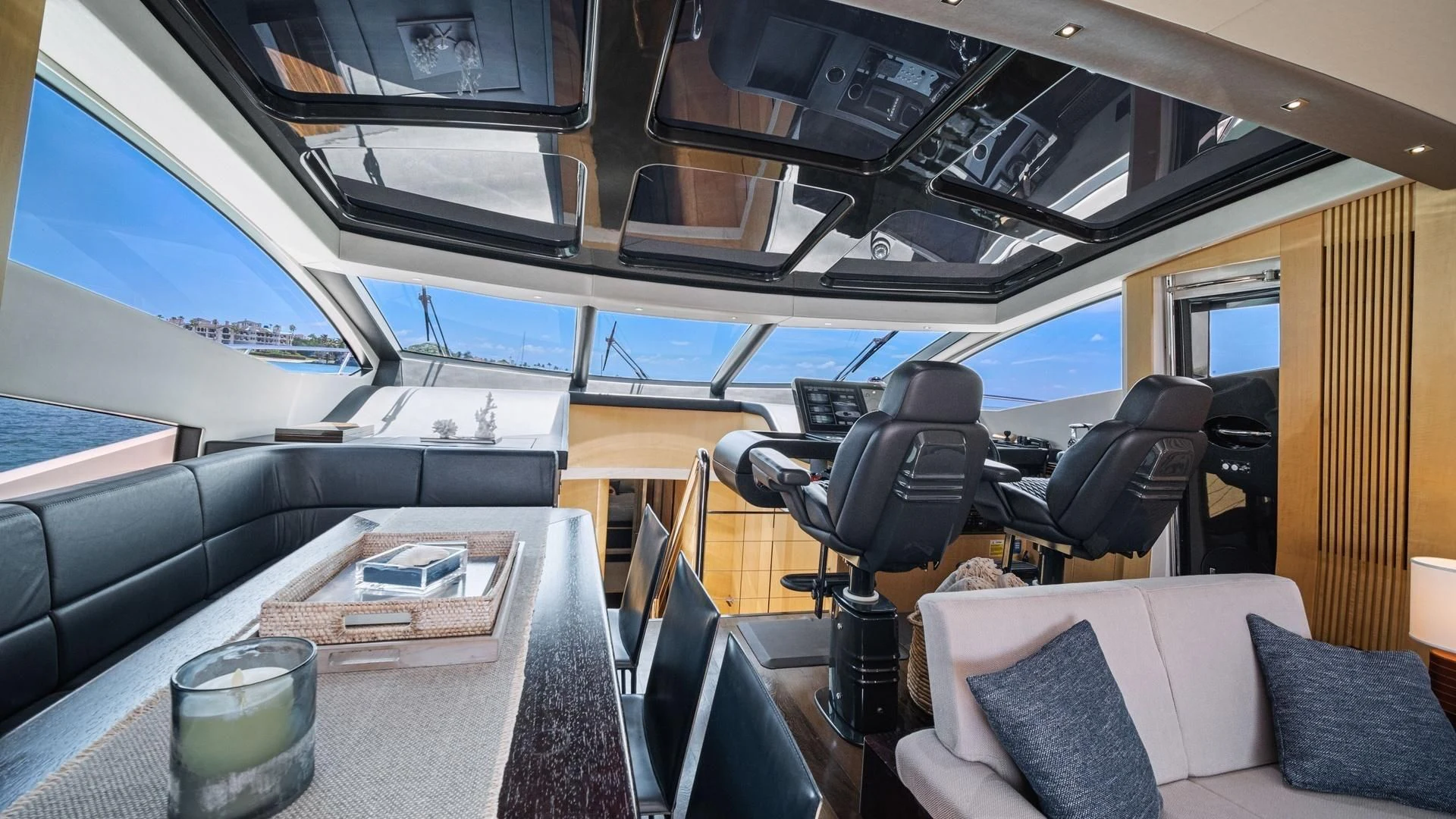 inside of a vehicle with a table and chairs and a glass of water aboard WOODEVER Yacht for Sale
