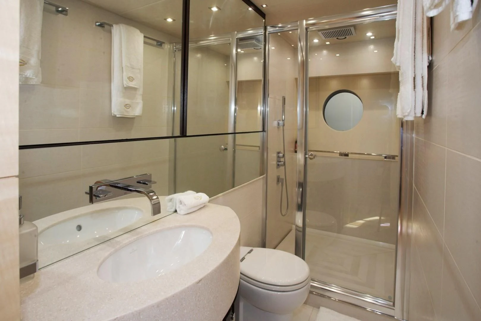 a bathroom with a glass shower door aboard WOODEVER Yacht for Sale