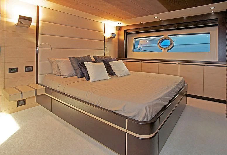 a room with a bed and a television aboard WOODEVER Yacht for Sale