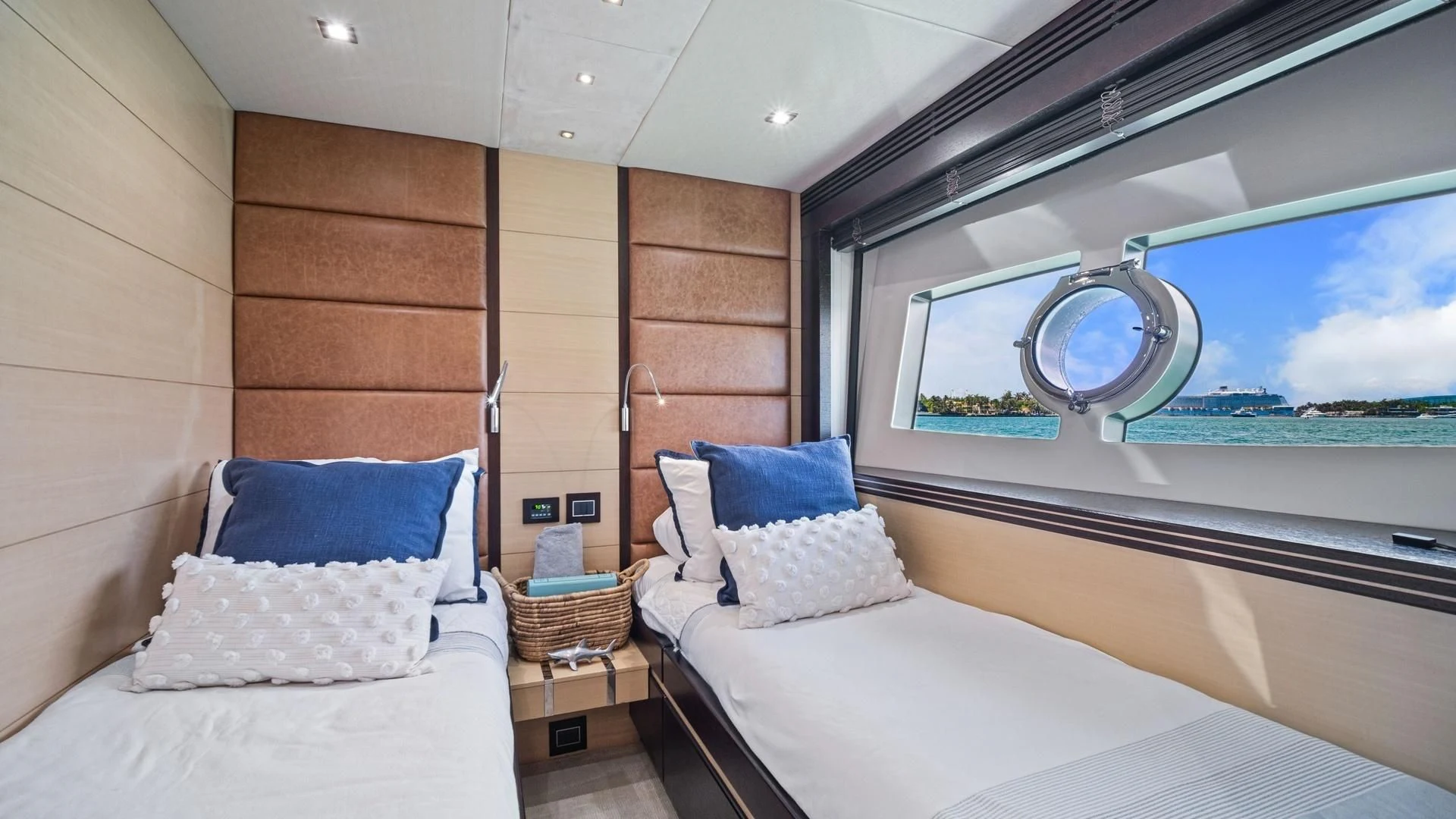 a room with a bed and a large mirror aboard WOODEVER Yacht for Sale
