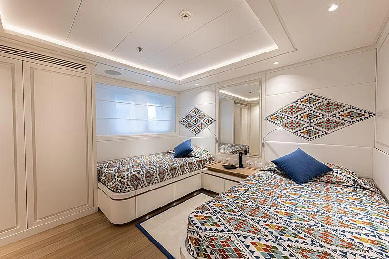 a bedroom with a couple beds aboard FRAMURA Yacht for Sale