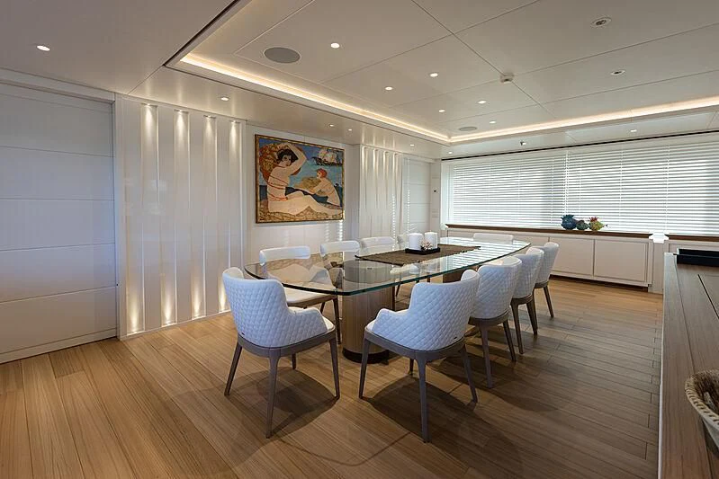 a kitchen with a table and chairs aboard FRAMURA Yacht for Sale