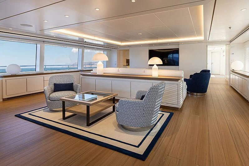 a living room with a large window aboard FRAMURA Yacht for Sale