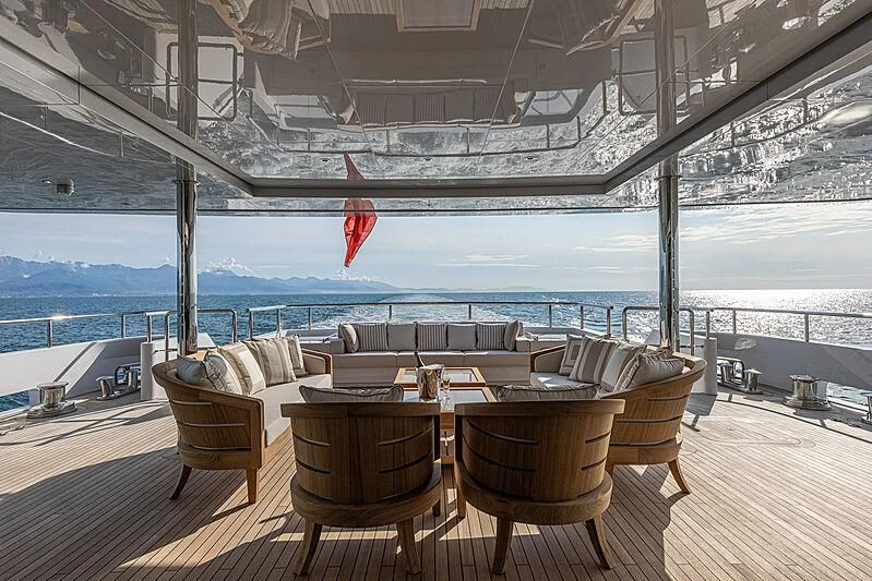 a deck with chairs and tables aboard FRAMURA Yacht for Sale