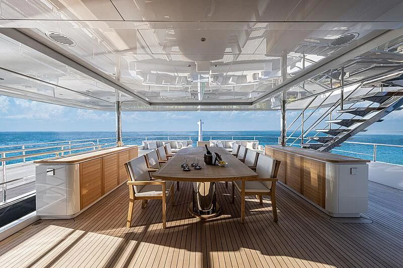 a room with a table and chairs aboard FRAMURA Yacht for Sale