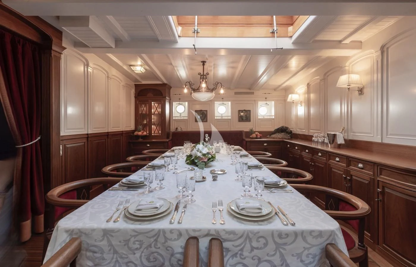 a large dining table in a large room aboard ATLANTIC Yacht for Charter