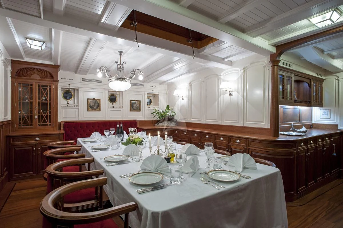 a dining room with a large table aboard ATLANTIC Yacht for Charter