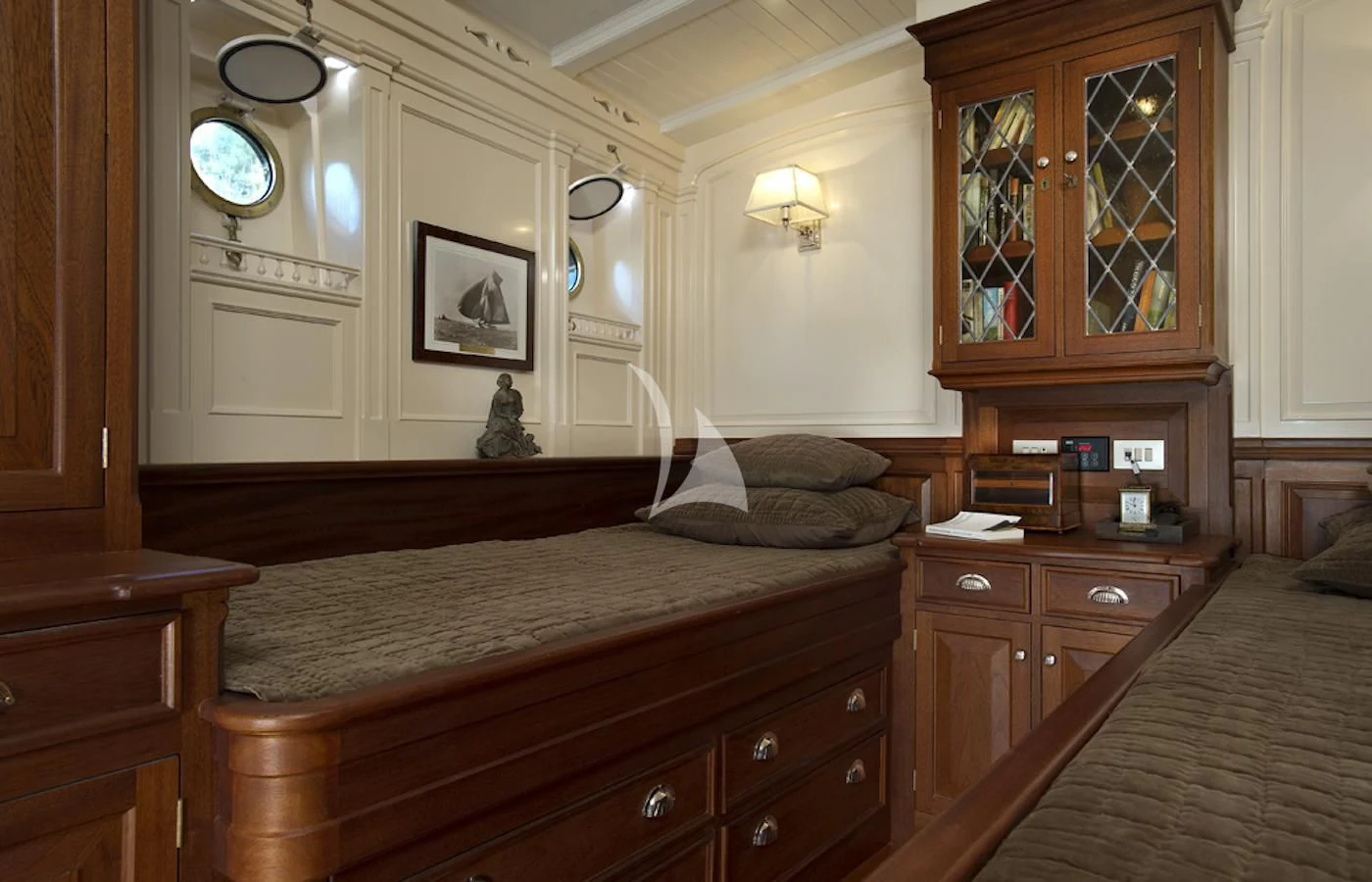 a bedroom with a bed and a dresser aboard ATLANTIC Yacht for Charter
