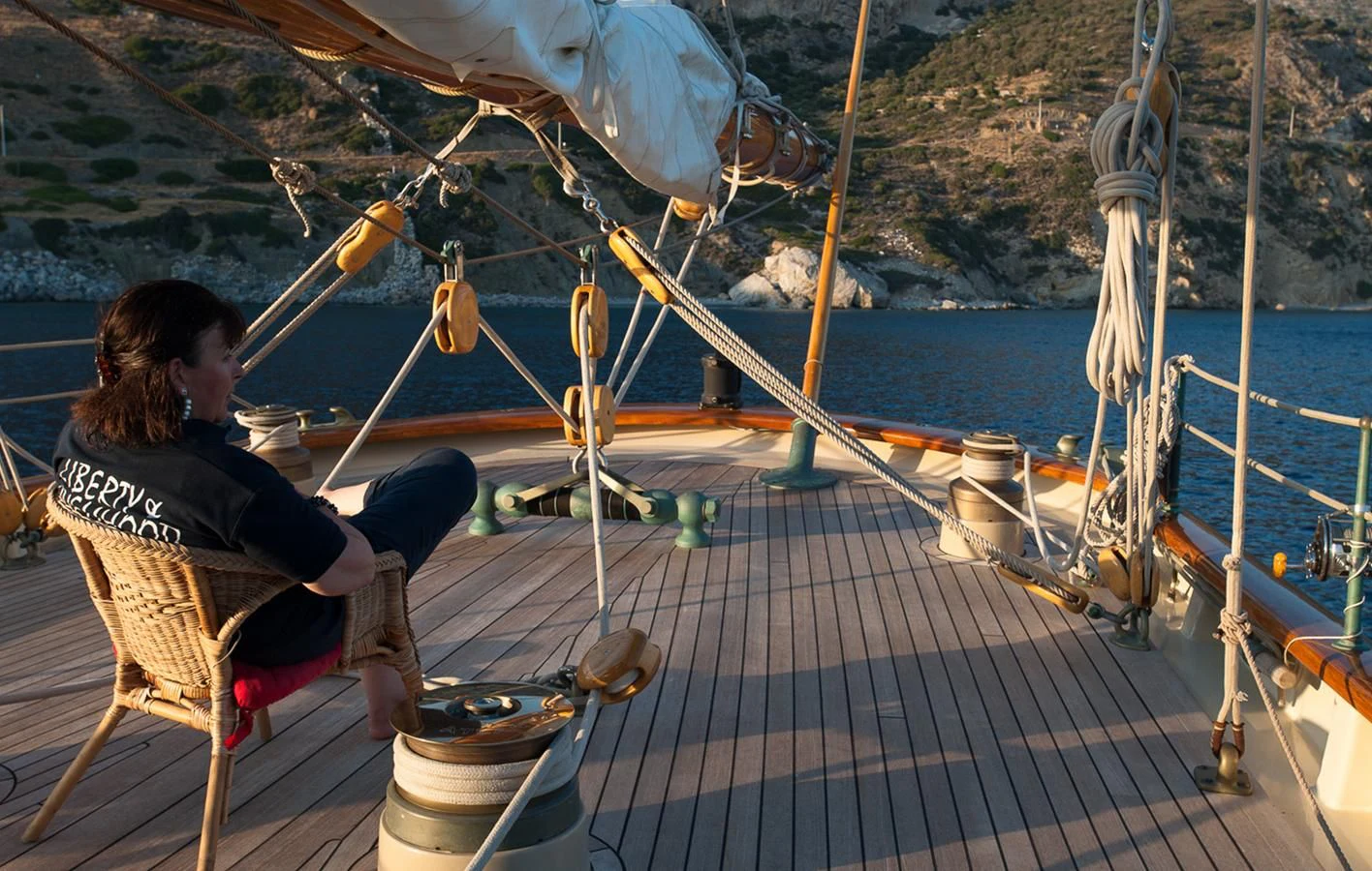 a person sitting on a chair on a boat aboard ATLANTIC Yacht for Charter