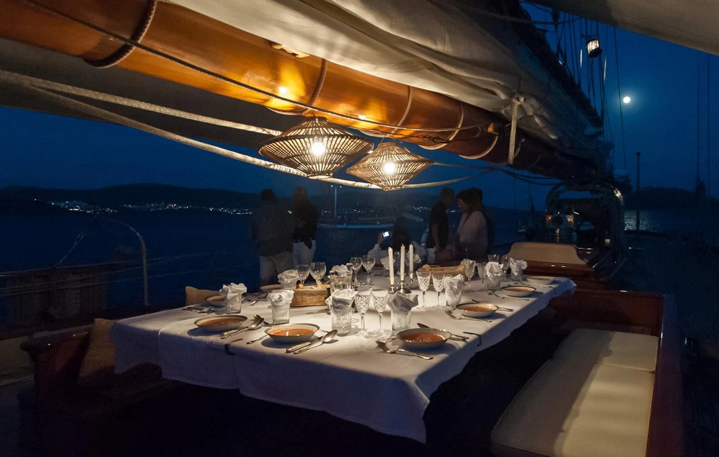 a group of people at a dinner party aboard ATLANTIC Yacht for Charter