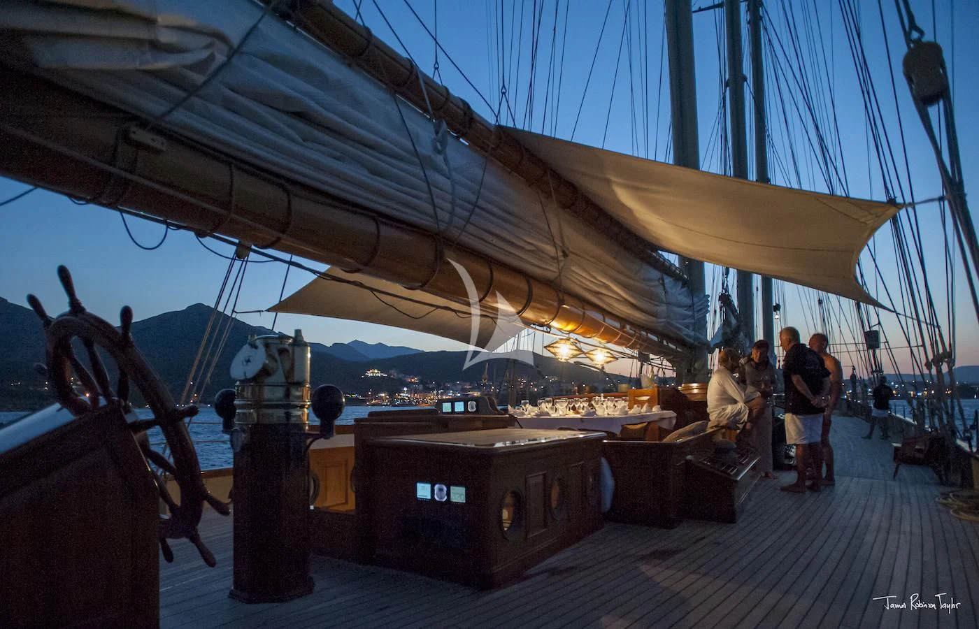 a boat with a large crowd of people around it aboard ATLANTIC Yacht for Charter