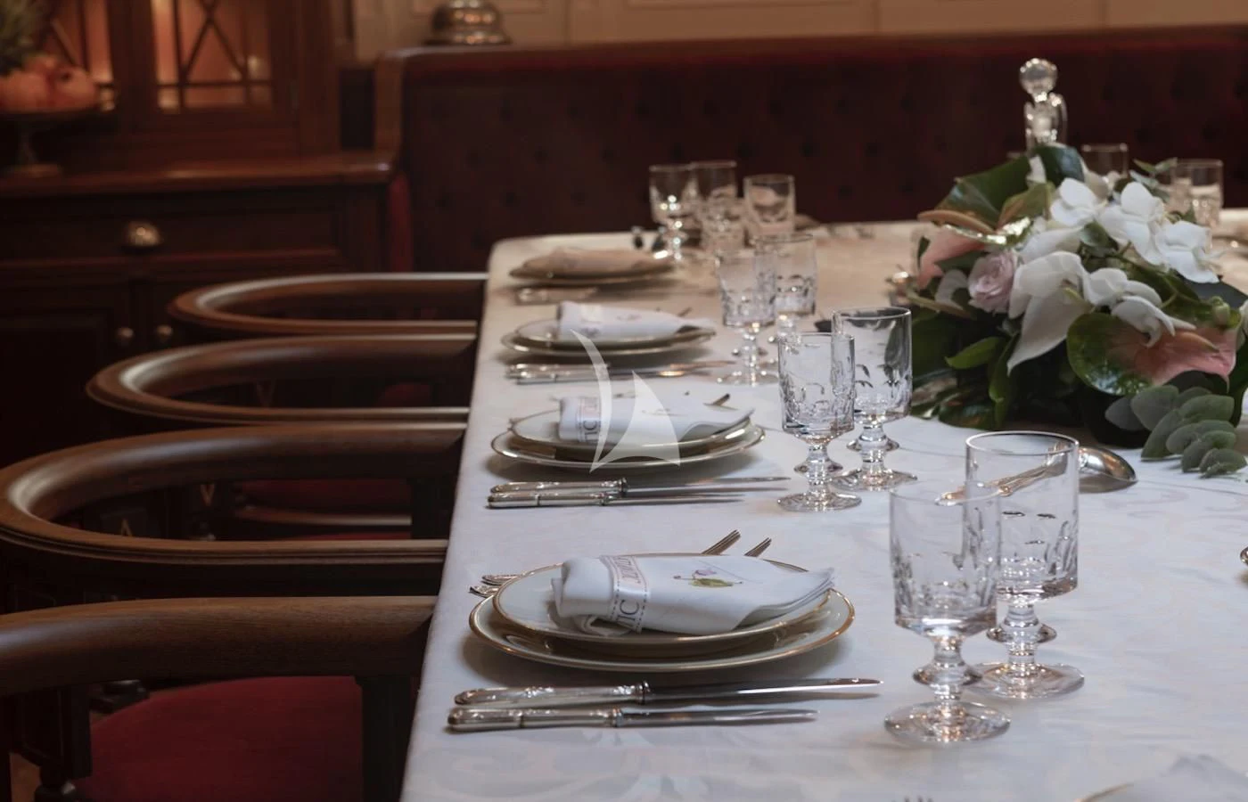 a table set with place settings aboard ATLANTIC Yacht for Charter